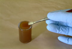 fecal_flotation-1 picture of a slide being placed on a sample